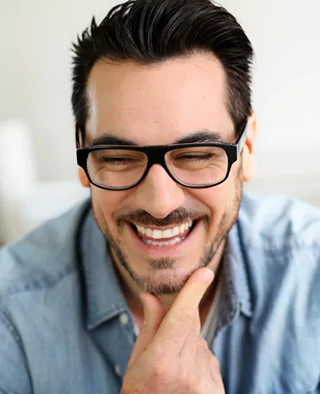 Smiling man shows off his Lumineers from Kennesaw dentist Dr. Anderson.