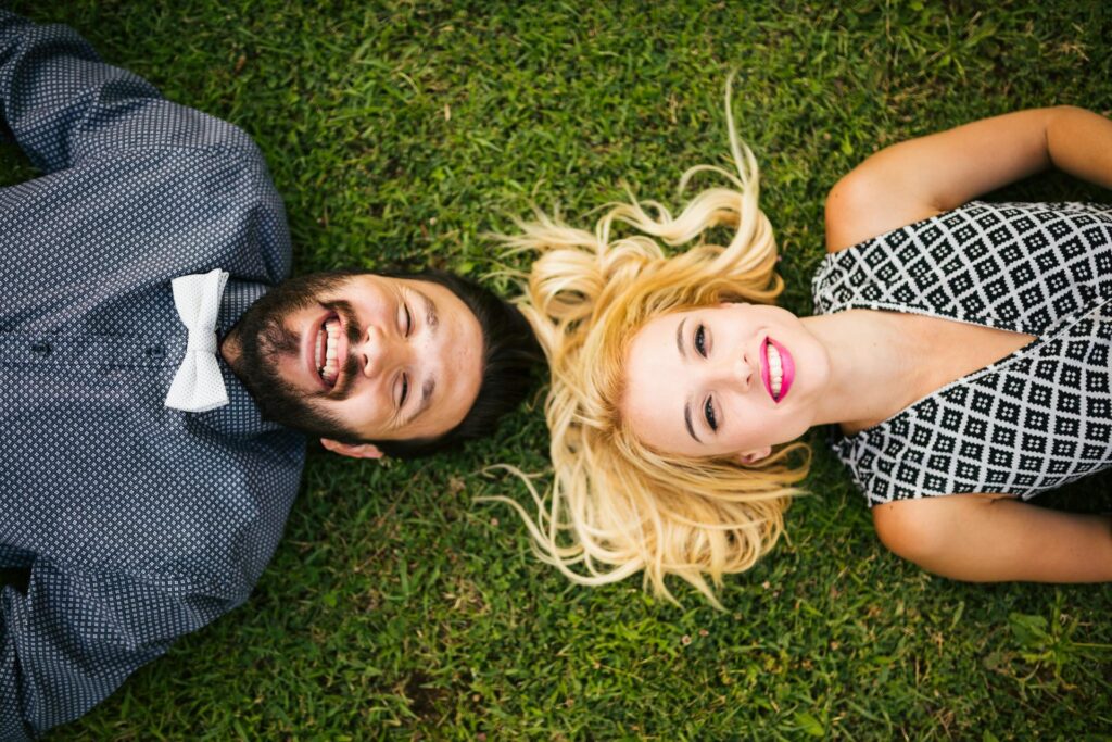 A young man and woman with picture-perfect smiles thanks to cosmetic dentistry in Kennesaw.