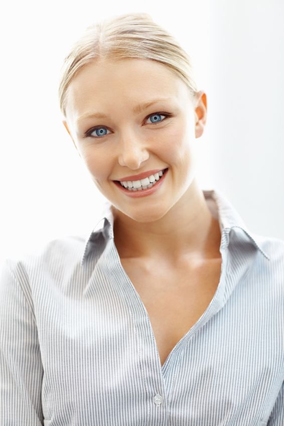 A young woman smiling after clear aligners in Kennesaw.