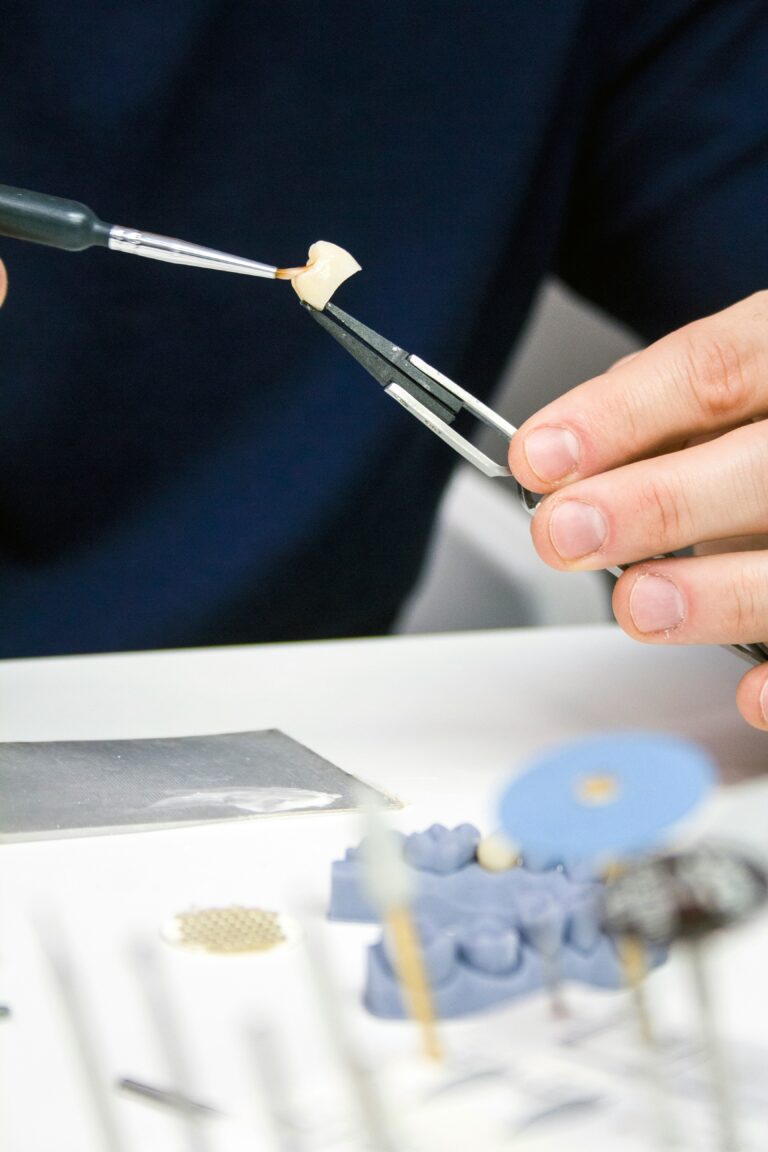 kennesaw dentist shaping a dental crown